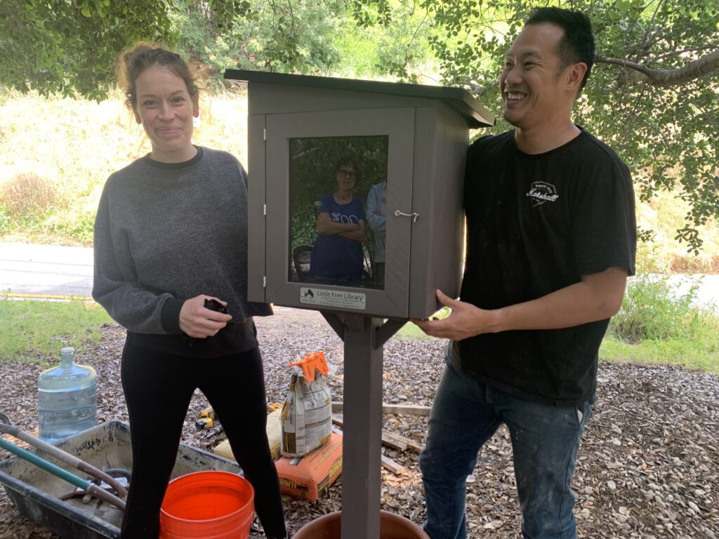 Sarah & Andrew positioning the new Little Library