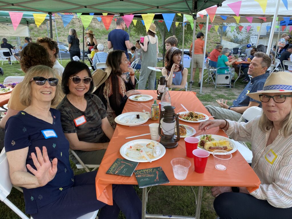 Neighbors enjoying their meals at the 2023 MWJN Potluck in the Park